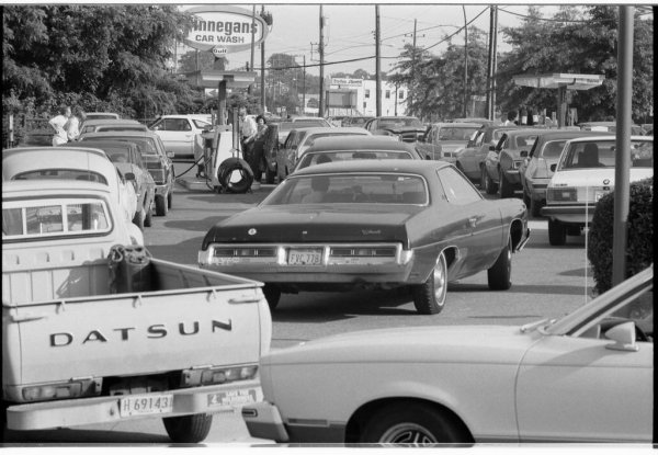 Photograph of cars at a gas station