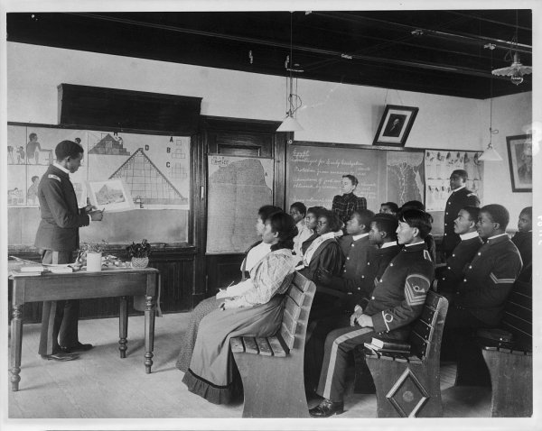 Photo of African American and Native American students in Ancient History class by Frances Benjamin Johnston, 1899.