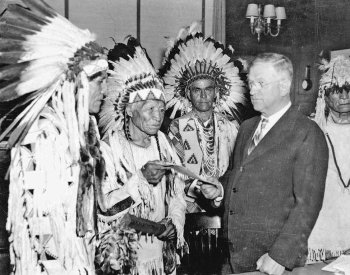 Image: Photo of Secretary of Interior Harold Ickes and delegates of the Confederated Tribes of the Flathead Indian Reservation in 1935.